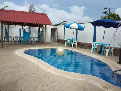a swimming pool with a ball in the water at Phandy in Santa Veronica