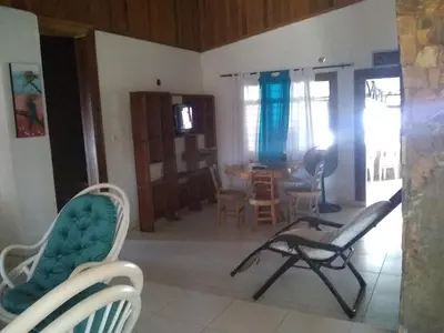a living room with two chairs and a table at Phandy in Santa Veronica