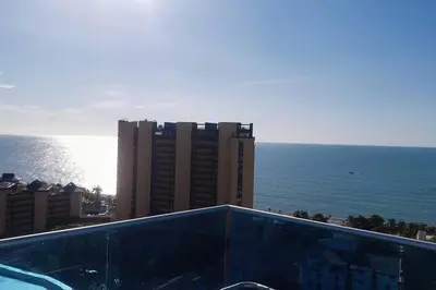 a view of the ocean from a balcony of a building at Hermoso apartamento. Cerca del mar. in Santa Marta