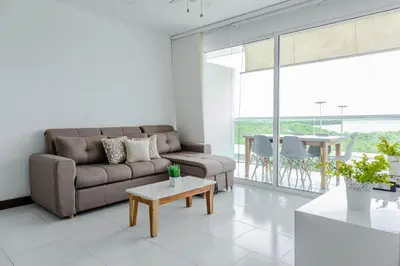 a living room with a couch and a table at apartamento 1 alcoba morros 922 rnt 132107 in Cartagena de Indias