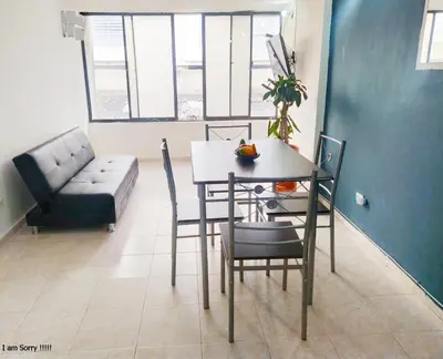 a dining room with a table and chairs and a couch at APT cercano centro Histórico N - Marbella O in Cartagena de Indias