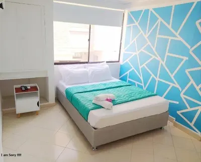 a bedroom with a bed with a teddy bear on it at APT cercano centro Histórico N - Marbella O in Cartagena de Indias