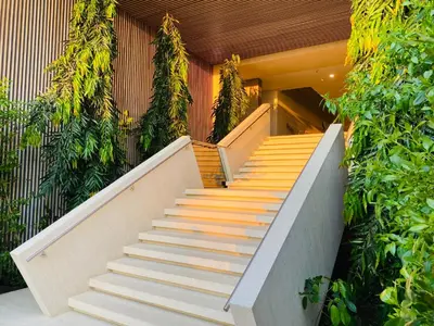 a staircase leading up to a building with plants at !Condominio de Lujo! Playa + Piscinas + Natural in Cartagena de Indias