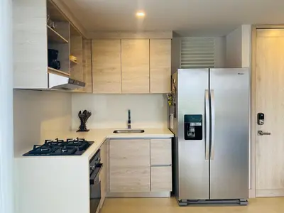a kitchen with a refrigerator and a stove at ✰ Beach Loft ✰ Condominio de lujo ✰ in Cartagena de Indias