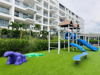 a playground in front of a large building at Amazing Loft / Private Beach + Pools + Natural in Cartagena de Indias