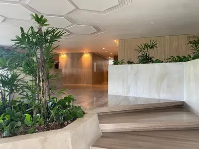 a lobby with plants on the walls of a building at Amazing Loft / Private Beach + Pools + Natural in Cartagena de Indias