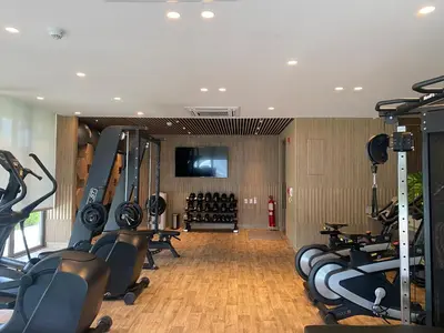 a gym with a bunch of treadmills and machines at Amazing Loft / Private Beach + Pools + Natural in Cartagena de Indias