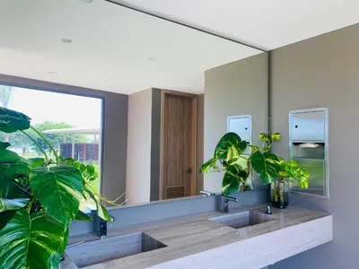 a bathroom with two sinks and a large mirror at Amazing Loft / Private Beach + Pools + Natural in Cartagena de Indias
