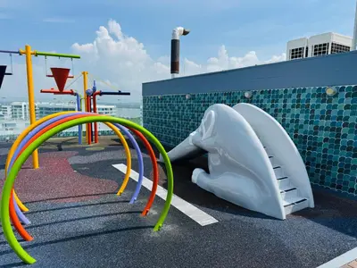 a playground with colorful colored slides and swings at ¡Amazing Beach Dúplex! Infinity Pool / Rooftop in Cartagena de Indias