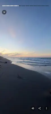 a beach with footprints in the sand and the ocean at Apart Cabaña KTIK in San Bernardo del Viento