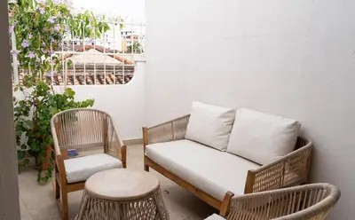 a couch and two chairs on a balcony at Casa Badillo 2 OLD CITY CRAZY LOCATION 4br jacuzzi wifi Ac hottub in Cartagena de Indias