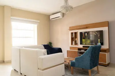 a living room with a couch and a tv at Casa Badillo 2 OLD CITY CRAZY LOCATION 4br jacuzzi wifi Ac hottub in Cartagena de Indias