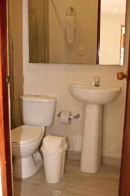 a bathroom with a toilet and a sink at Casa Moneda 1 5BR amazing house picusi AC old city in Cartagena de Indias