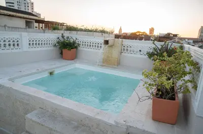 a hot tub on the balcony of a building at Casa Quero 954 COZY HOUSE ROOFTOP POOL AC OLD CITY in Cartagena de Indias
