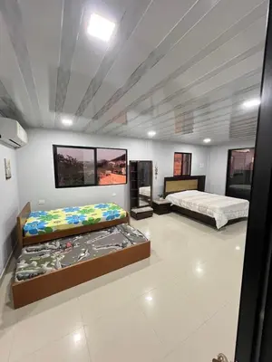 a room with two beds in a room at APARTAMENTOS AMOBLADOS in Santa Marta