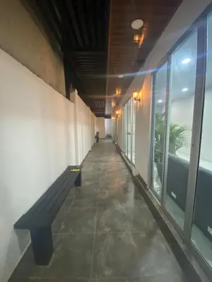 an empty hallway with a bench in a building at APARTAMENTOS AMOBLADOS in Santa Marta