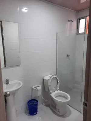 a bathroom with a toilet and a sink and a shower at HOTEL MAR DEL CARIBE in Soledad