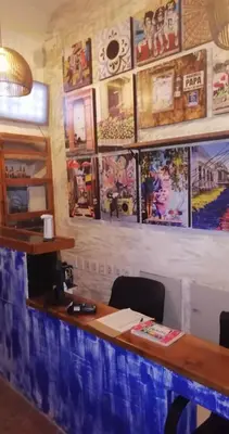 a bar with pictures on the wall in a restaurant at Casa Ebano 967 in Cartagena de Indias