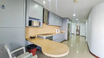 a kitchen with a table in the middle of it at Luxury apartment, sector morros, vista y salida al mar edificio Sunshine in Cartagena de Indias