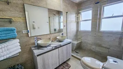 a bathroom with two sinks and a mirror at Luxury apartment, sector morros, vista y salida al mar edificio Sunshine in Cartagena de Indias