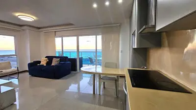 a kitchen and living room with a view of the ocean at Luxury apartment, sector morros, vista y salida al mar edificio Sunshine in Cartagena de Indias