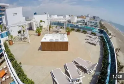 arial view of a patio with chairs and the beach at Luxury apartment, sector morros, vista y salida al mar edificio Sunshine in Cartagena de Indias