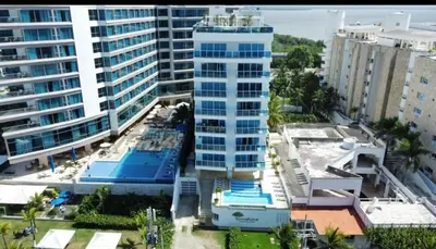 an aerial view of a tall building in a city at Luxury apartment, sector morros, vista y salida al mar edificio Sunshine in Cartagena de Indias