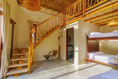 a room with a bunk bed and a staircase at Casa Mambo Salinas in Santa Veronica