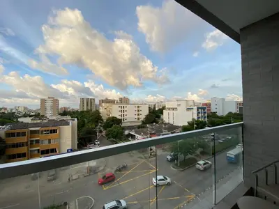 a view of a parking lot from a balcony at Apartaestudio Amoblado - Distrito90 in Barranquilla