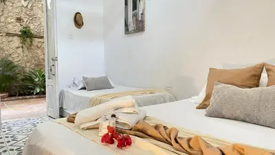 two beds sitting next to each other in a room at Casa Ego in Cartagena de Indias