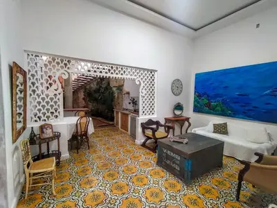 a living room with a couch and a table at Casa Ego in Cartagena de Indias