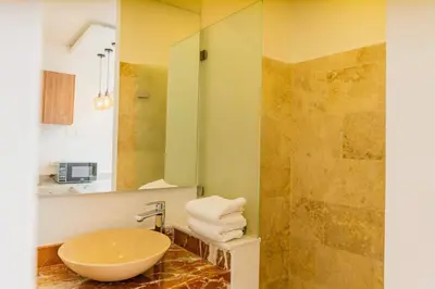 a bathroom with a sink and a shower at Del Mar Guest House in Cartagena de Indias