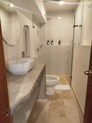 a bathroom with a sink and a toilet at Del Mar Guest House in Cartagena de Indias