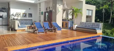 a house with a swimming pool and blue chairs at Nuestra Casa in Tubará