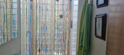 a curtain with colorful patterns on a wall at Nuestra Casa in Tubará