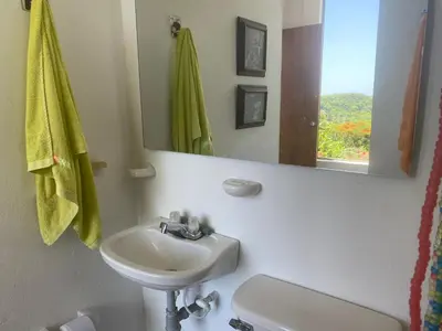 a bathroom with a sink and a mirror at Nuestra Casa in Tubará