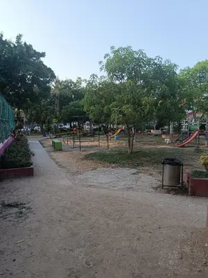 a park with a playground with trees and a path at Casa Para 3 a 12 personas in Cartagena de Indias
