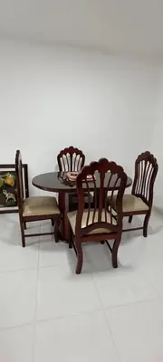 a dining room table and two chairs and a table at Casa Para 3 a 12 personas in Cartagena de Indias