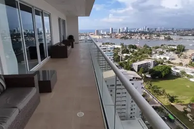 a balcony of a building with a view of the city at Lujoso apartamento Boca grande Condominio H2 in Cartagena de Indias