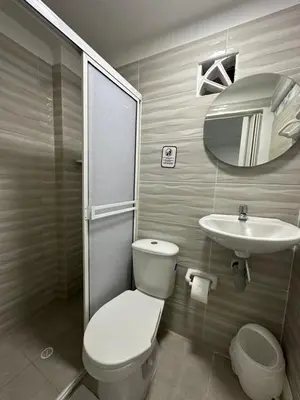 a bathroom with a toilet and a sink at Casa Cielo Cartagena in Cartagena de Indias