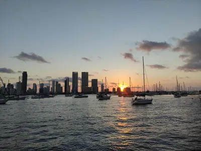 a group of boats in the water with a city skyline at Apartamento Cartagena 180, vista espectacular in Cartagena de Indias