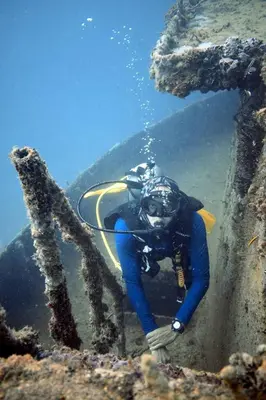 a diver standing in the water in the ocean at Apartamento Cartagena 180, vista espectacular in Cartagena de Indias