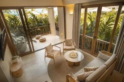 a living room with a couch and a table at Hotel Aimarawa in Coveñas