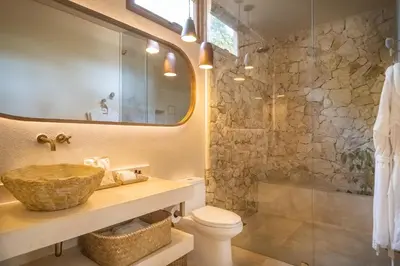 a bathroom with a sink and a shower at Hotel Aimarawa in Coveñas