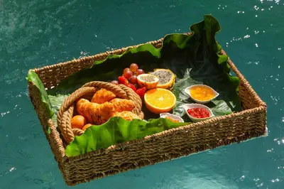 a basket filled with food on top of the water at Moet Cartagena Hotel Boutique Adutls Only in Cartagena de Indias