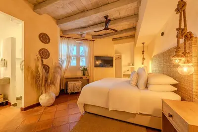 a bedroom with a white bed in a room at Moet Cartagena Hotel Boutique Adutls Only in Cartagena de Indias