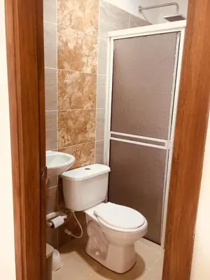 a bathroom with a toilet and a sink at Cabañas Paulamar-Apto 3- Tolu in La Gloria