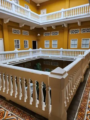 a staircase in a building with yellow walls at Hermoso Apto en el corazón de la ciudad amurallada in Cartagena de Indias