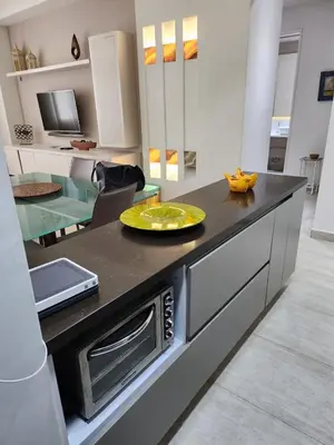 a kitchen with a counter with a yellow plate on it at Hermoso Apto en el corazón de la ciudad amurallada in Cartagena de Indias
