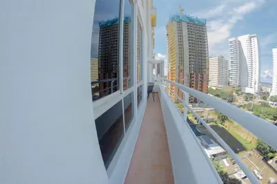 a balcony with a view of a city with tall buildings at Exclusive House Cartagena in Cartagena de Indias